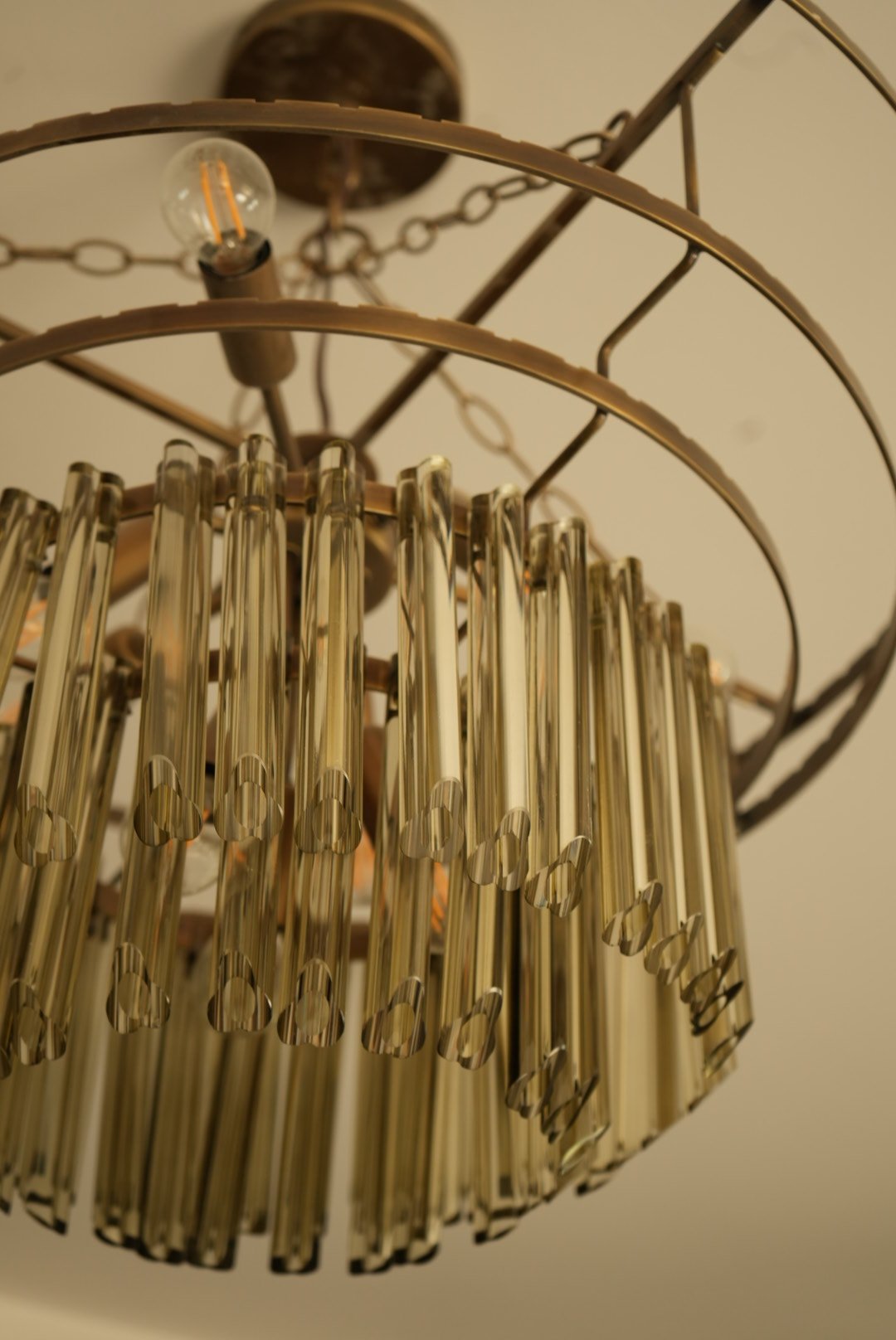 Glass rods hung from bronze rings