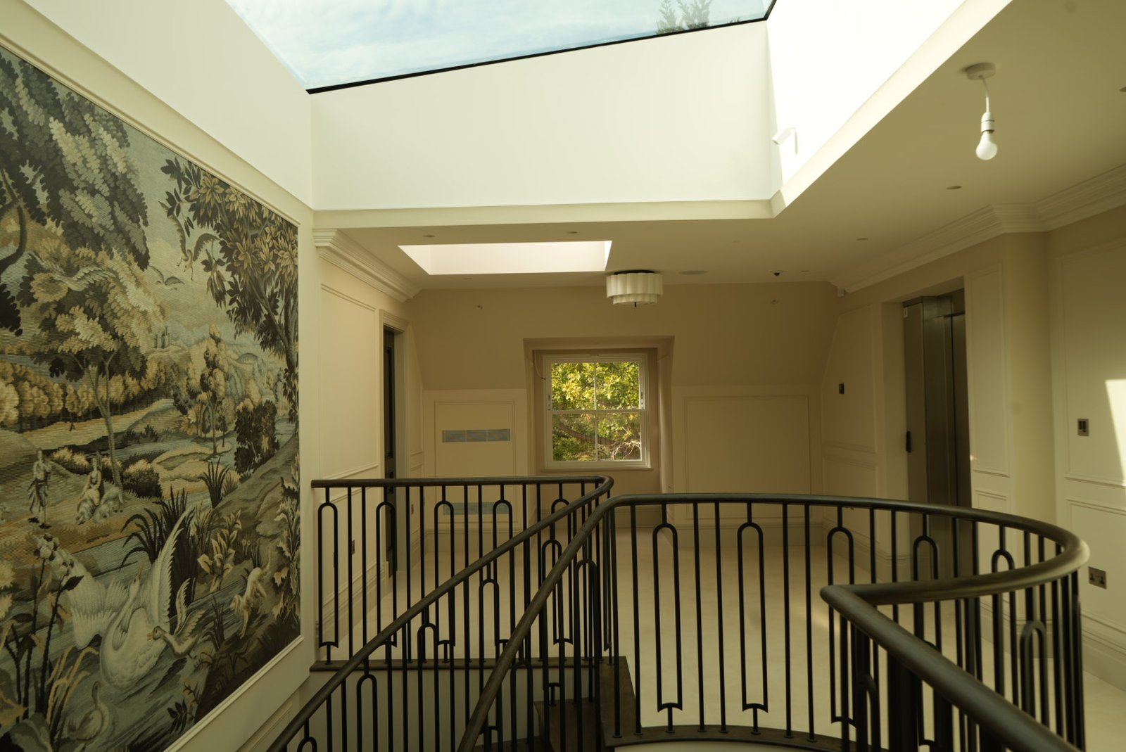 The mural, the landing and the curve of the balustrade