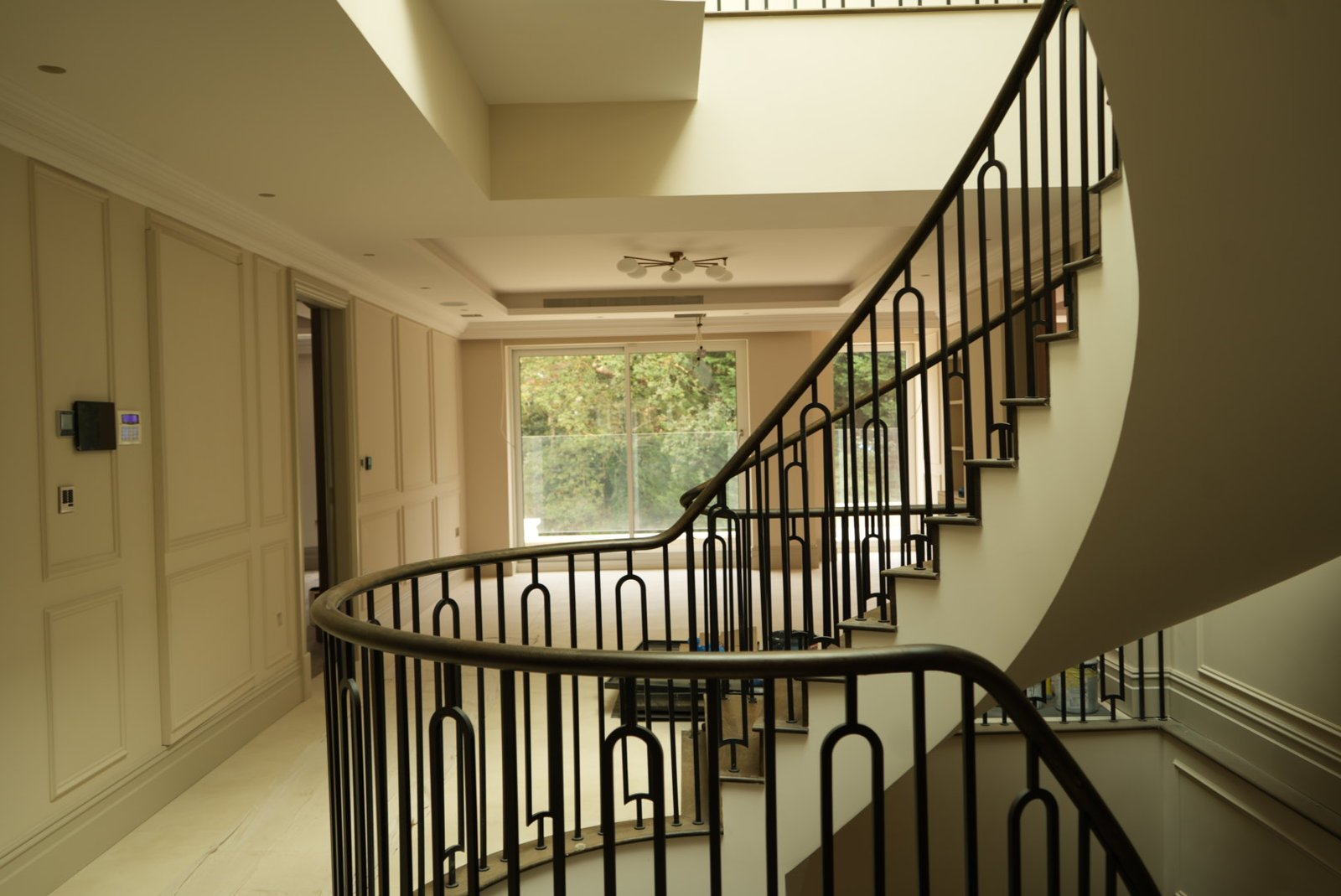 The stair sweeping onto the first-floor landing