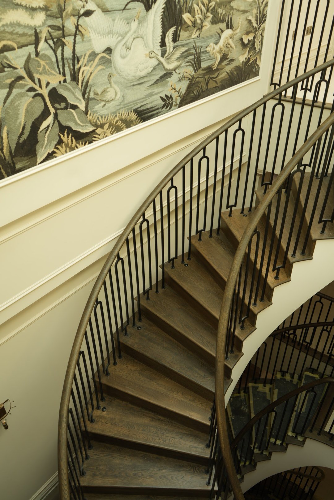 The stair climbing beneath the mural