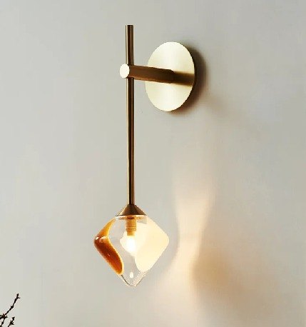 A brass and glass wall light