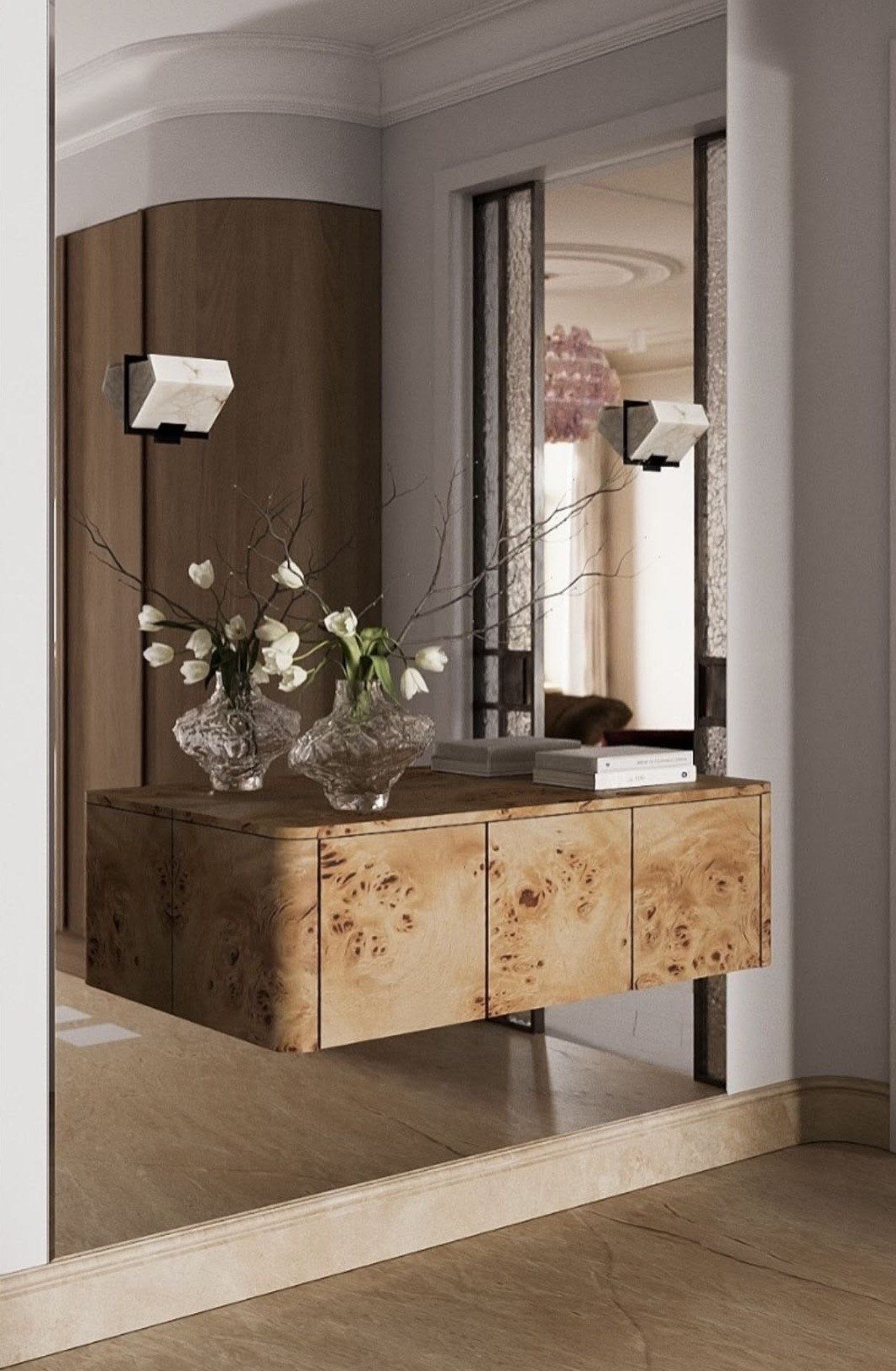 A floating burl console beneath alabaster sconces