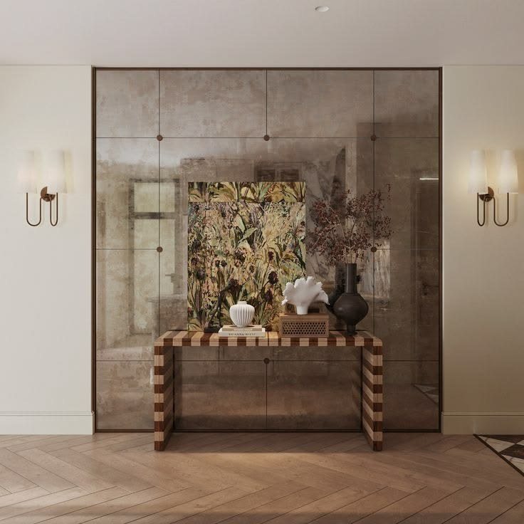 Antique mirror panelling behind a striped console