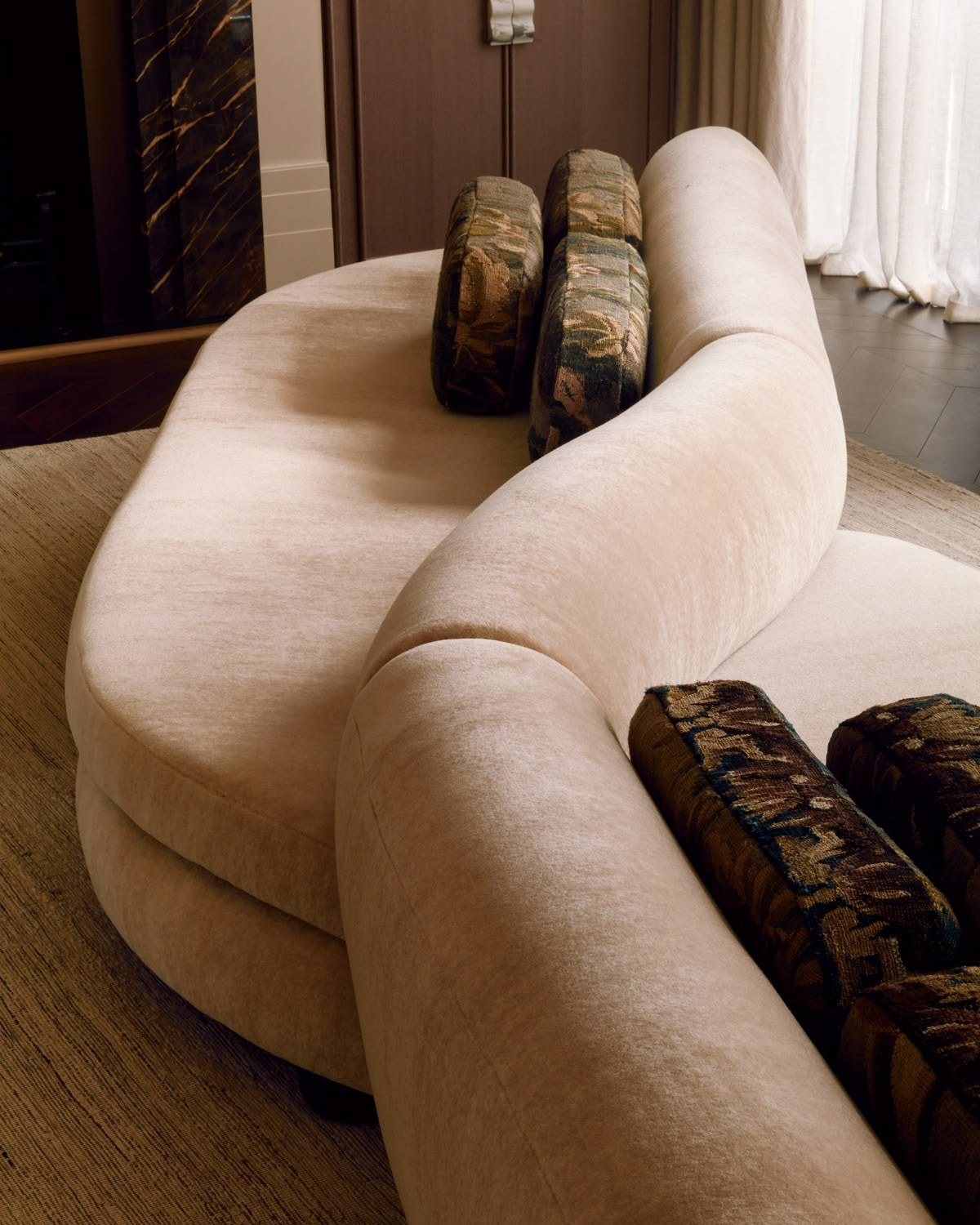 Curved seating in pale velvet