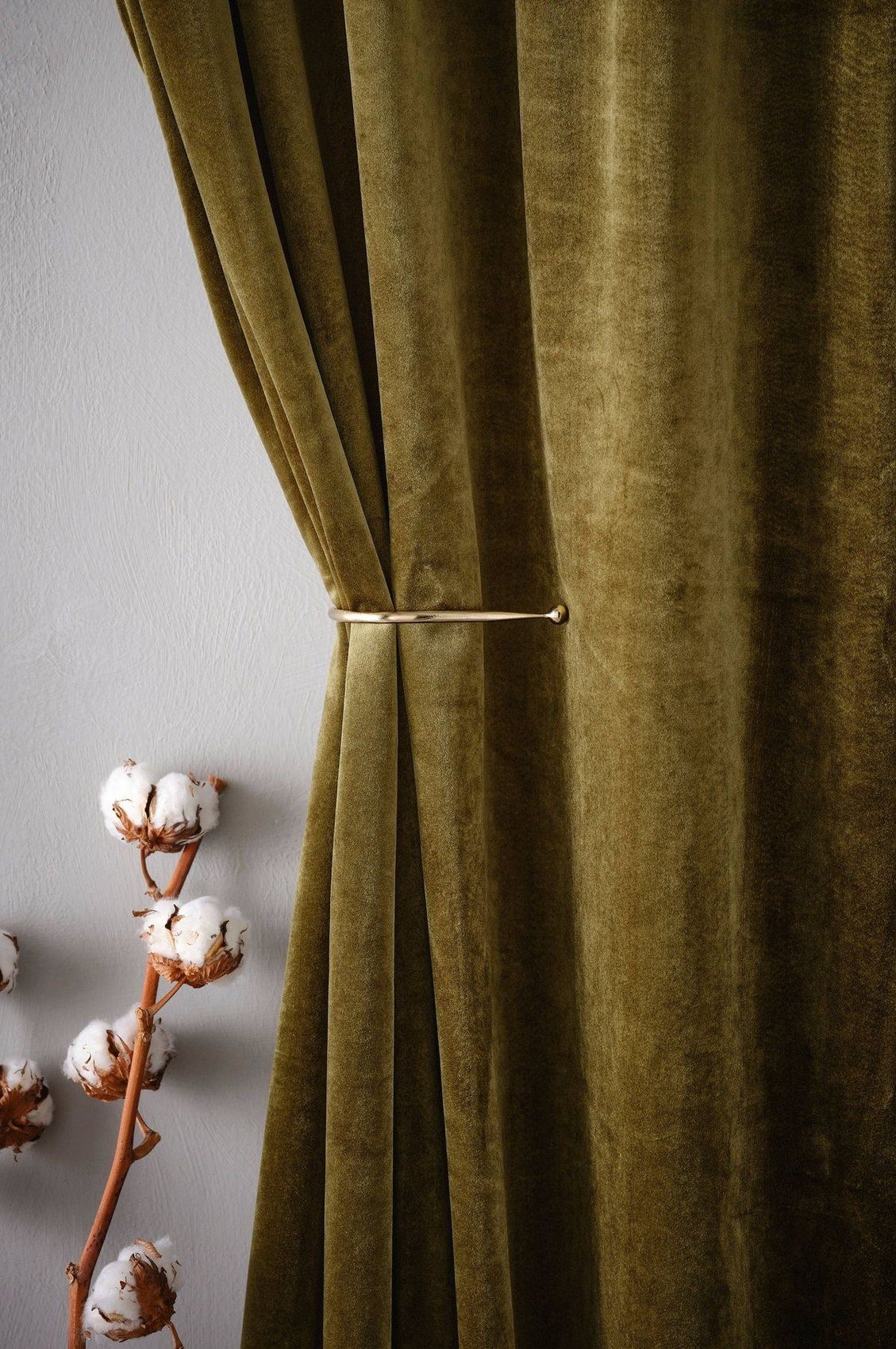 Olive velvet with a brass holdback
