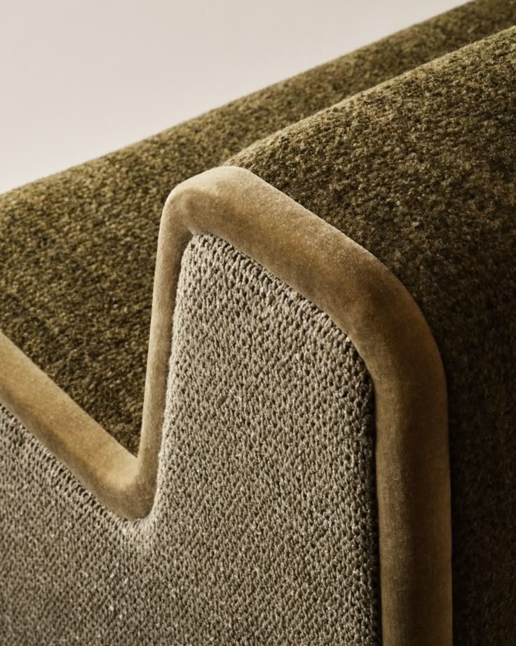 Olive upholstery with a piped velvet edge