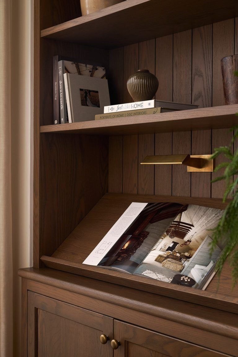 A reading ledge beneath a brass picture light