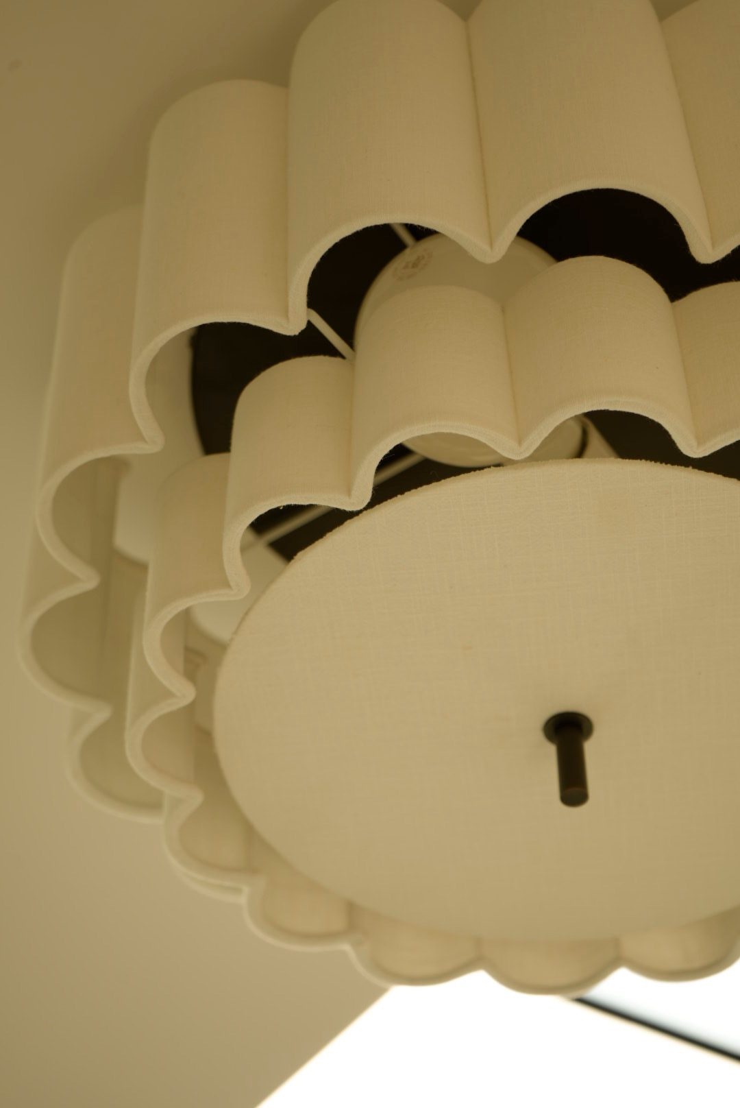 A scalloped pendant light