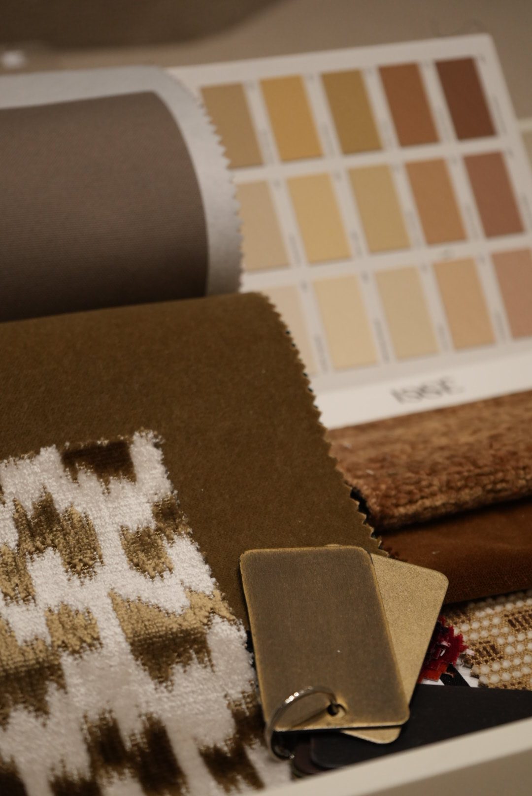 Velvet, wool and paint swatches gathered for a design scheme
